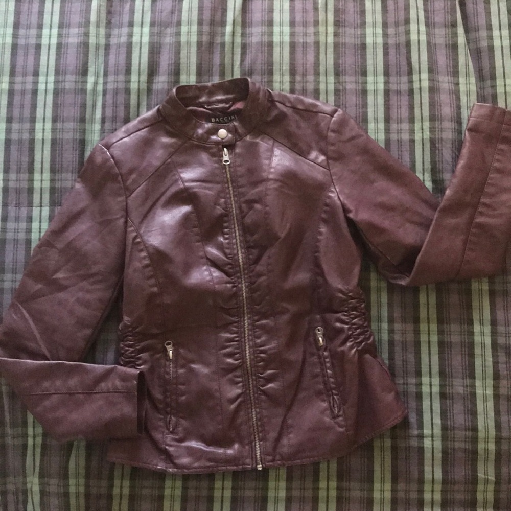 Faux leather jacket. Zip front. Fully lined